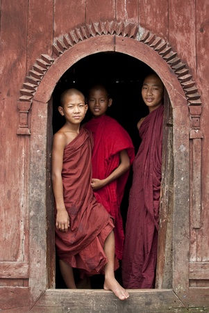 Shan State, Burma, 26 July 2010, Novice monks standing in temple doorwayのeditorial素材