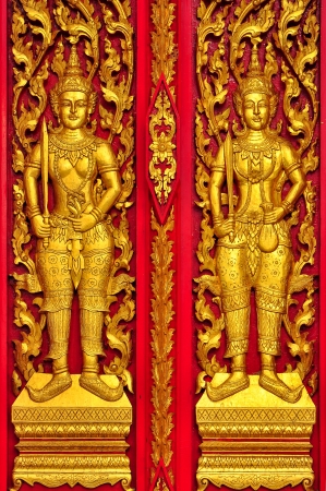 Red Door Woodcarving in Thai Templeの写真素材