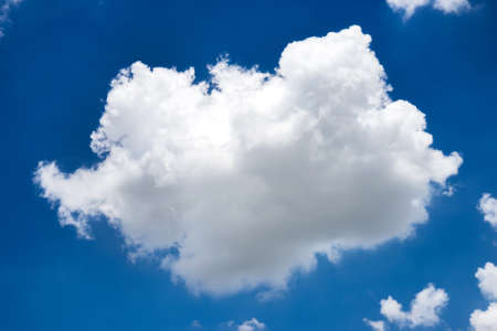 fluffy cloud in blue skyの写真素材