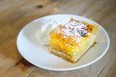 fruits cake served with cream, topping with  icing sugarの写真素材