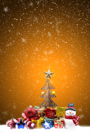 christmas decoration on orange light background with text spaceの写真素材