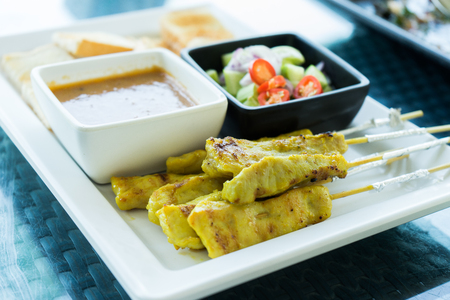 Pork Satay with peanut dipping sauceの写真素材