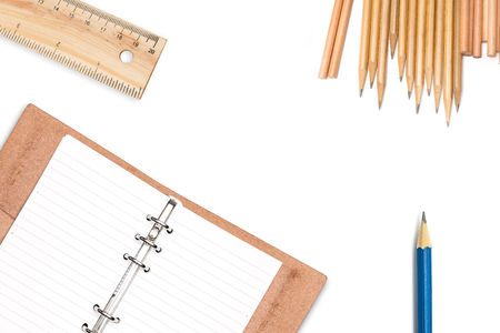 Drawings and design tools with leather organiser note book isolated on white backgroundの写真素材