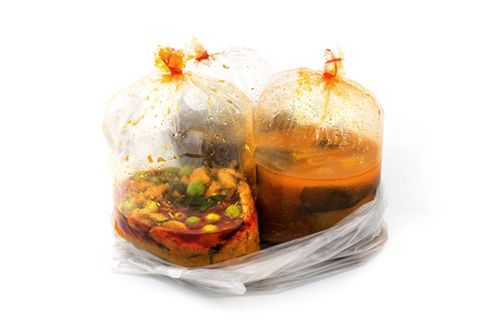 hot food in plastic bags in clear plastic containerの写真素材