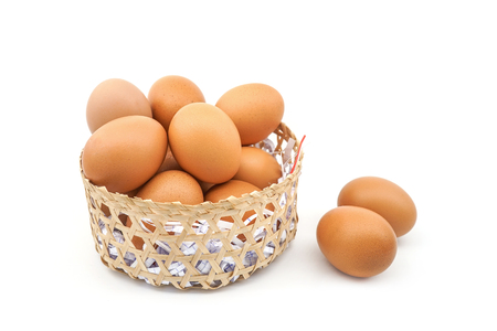 two eggs out of basket isolated on white backgroundの写真素材