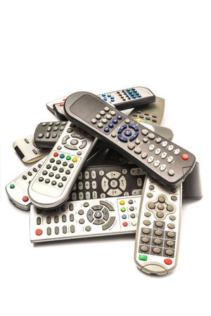 Stack of  remote wireless control electronics device on white backgroundの写真素材