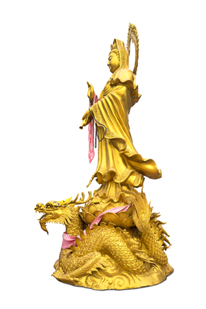 golden chinese god statue of Mazu or Guan Im in a public temple isolated on whiteの写真素材
