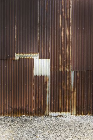 old rusty zinc plate fence wall backgroundの写真素材