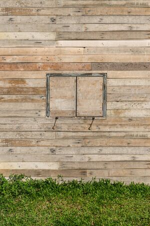 old window on wood wallの写真素材