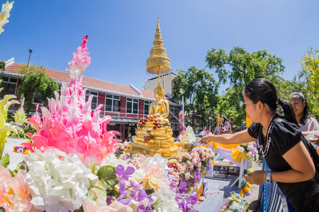 Bangkok, Thailand - April 12, 2017 : people splash scented water to bath  Buddha Image, the famous Buddha Image, blessing on Songkran, known as Water Festival and Thai New Year ceremony.のeditorial素材