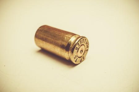 9mm. empty bullet - vintage tone backgroundの写真素材