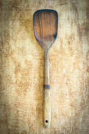 wooden spatula  on wood table backgroundの写真素材
