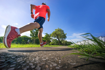 male runner jogging during outdoor workout -  running manの写真素材
