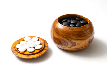 Chinese, Japan, Korean board game GO with black and white stone. Go or wei-Chi - WeiQi traditional asian board gameの写真素材