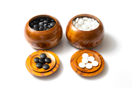 Chinese, Japan, Korean board game GO with black and white stone. Go or wei-Chi - WeiQi traditional asian board gameの写真素材