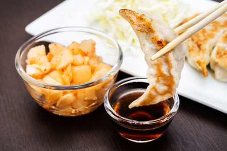 asian dumplings gyoza potstickers fried, dumplings snack , with soy sauceの写真素材