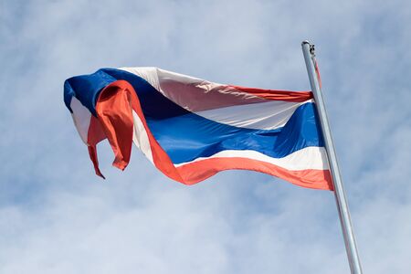 winding on Thailand flag on pole