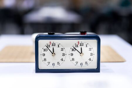 chess, baduk, weiqi, goban or broad game tournament tables with chess timers ready for players to...