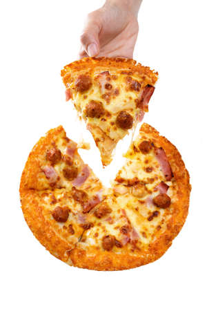 Hand taking a slice of italian cuisine pizza isolated on white