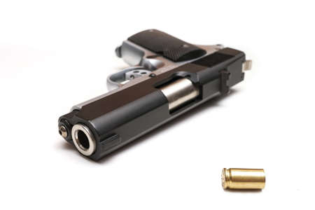 hand gun and empty bullet in vintage tone backgroundの写真素材