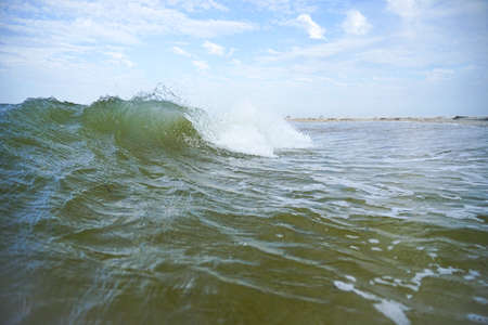 sea waves with clear water roll onto the shore
