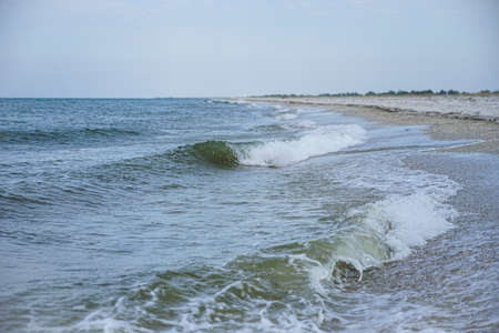 sea waves with clear water roll onto the shore