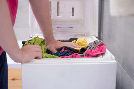 Underwear lies in the top-loading washing machineの写真素材