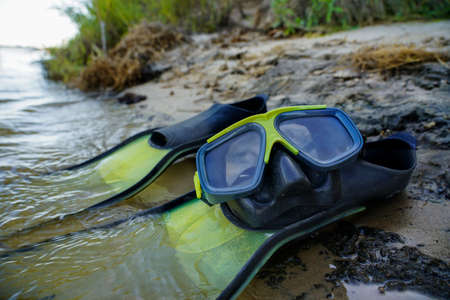fins with a mask for diving in the water on the islandの写真素材
