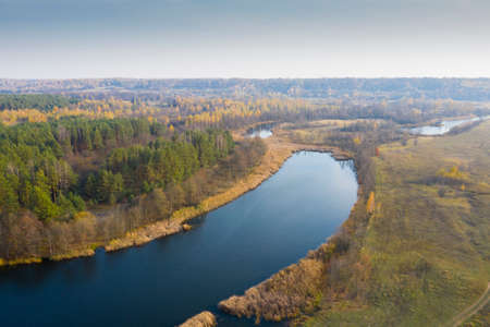 Lake with blue water view from the top. Autumn lake shot from a quadrocopter. lake in the forestの写真素材