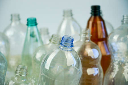 Plastic bottles for water and drinks in a white plastic boxの写真素材