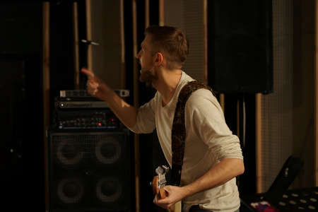 The guy plays the electric guitar