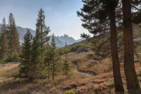Alpine Mountain Trail - A winding high alpine mountain trail leading to granite mountain in the background on the Pacific Crest Trail.の写真素材