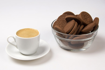 Cup of espresso and biscotti. White background.の写真素材