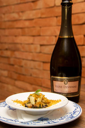 Grilled squid with mushrooms and bread loaf.のeditorial素材