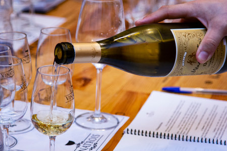 Wine being served in bowls for tasting.のeditorial素材