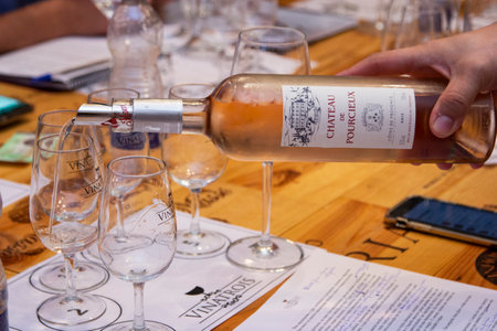 Wine being served in bowls for tasting.のeditorial素材