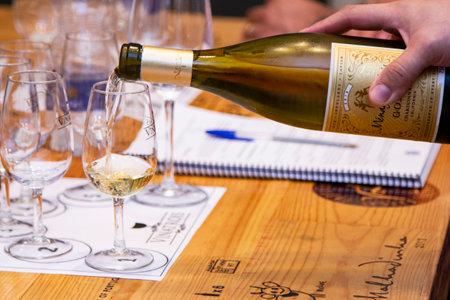 Wine being served in bowls for tasting.のeditorial素材