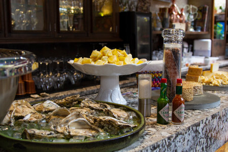 fresh oysters opened under ice board.の写真素材