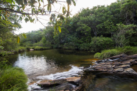 Beautiful lake in sunny day formed by waterfalls - Serra da Canastra National Park - Minas Gerais, Brazilの写真素材