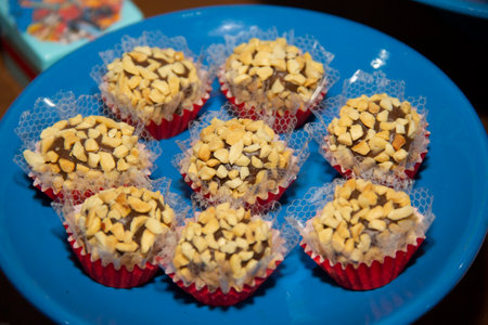 Peanut brigadeiro on the decorated birthday table, traditional Brazilian party candyの写真素材