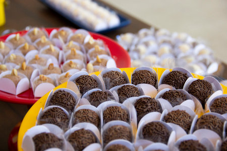 Brigadeiro and peanut jam on the decorated birthday table, traditional Brazilian party candy.の写真素材