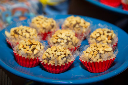 Peanut brigadeiro on the decorated birthday table, traditional Brazilian party candyの写真素材