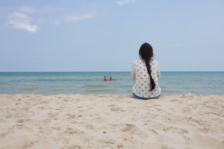 beautiful alone sensual girl on the beachの写真素材