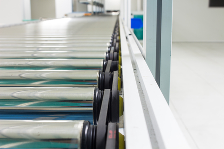 The conveyor chain, and conveyor belt on production line set up in clean room area.の写真素材