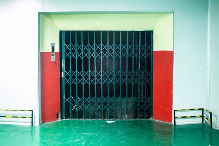 The old abandoned doors of elevator in buildingの写真素材