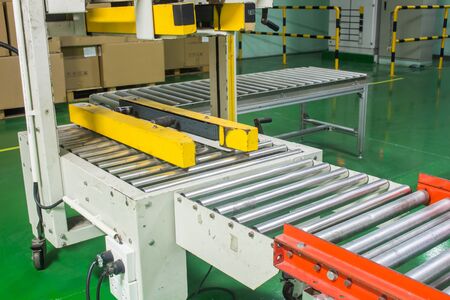 The semi auto taping machine for packing processの写真素材