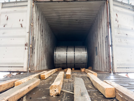 Loading master coil steel out of containerの写真素材