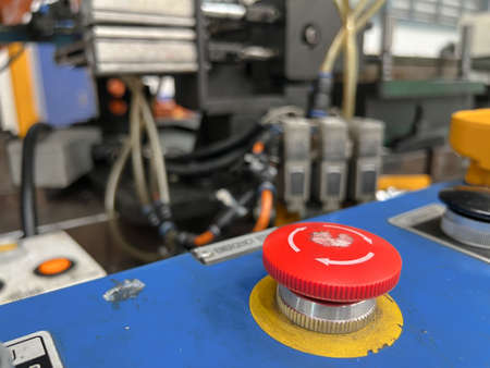 The Emergency stop button on control cabinet of   press machine.の写真素材