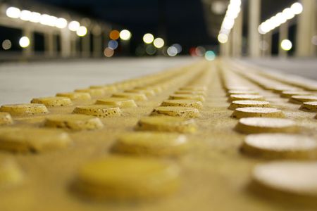 a yellow dot surface for blind personsの写真素材