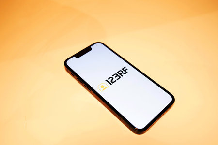 October 3, 2022: 123RF logo on smartphone screen. Focus on smartphone.